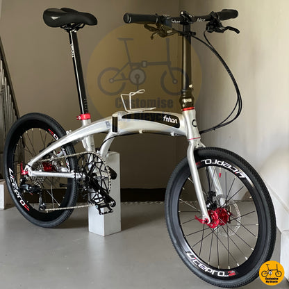 Foldable bicycle with black and red accent components
