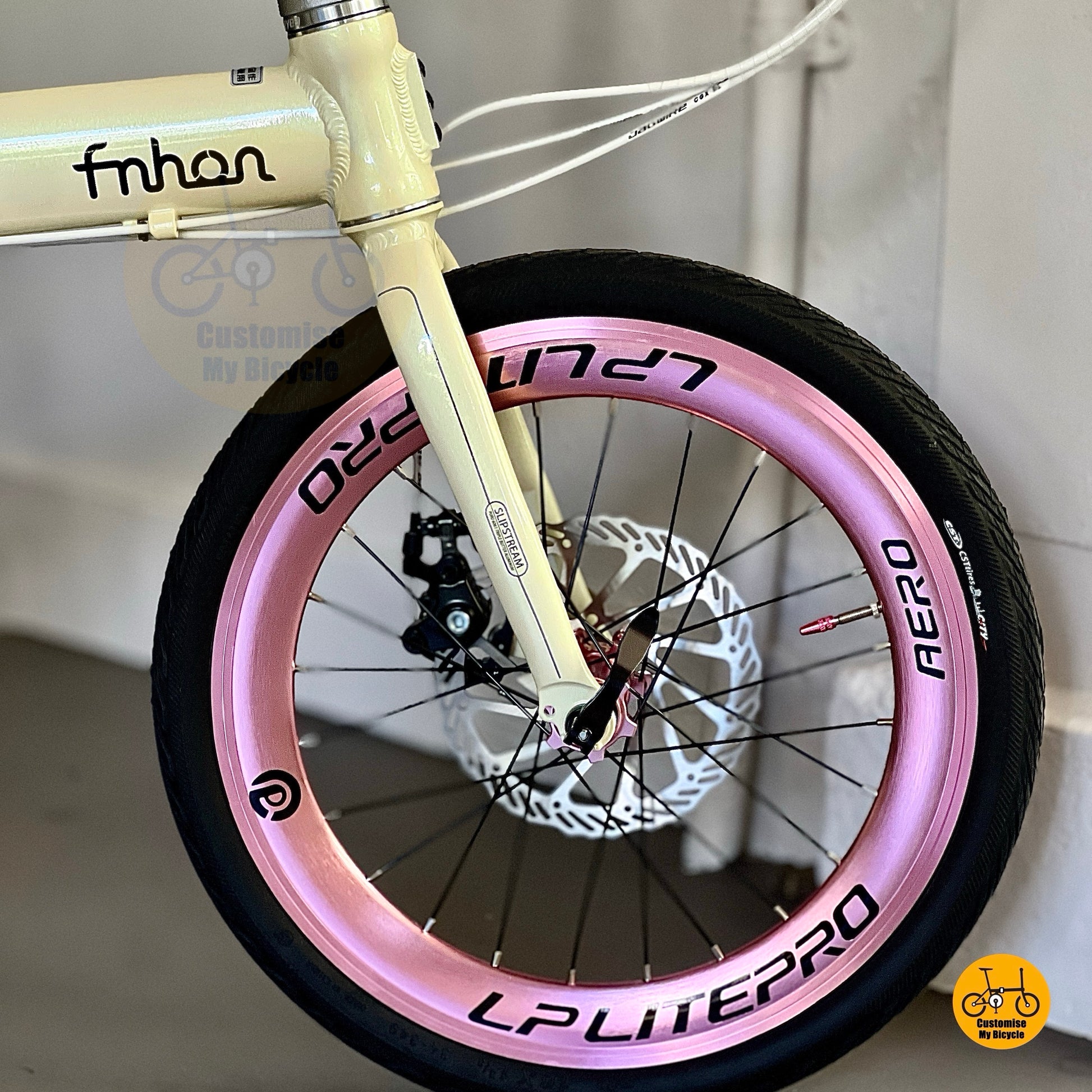 Side view of Fnhon Zephyr 18 inch beige folding bike with Shimano 9 gears and Litepro wheels
