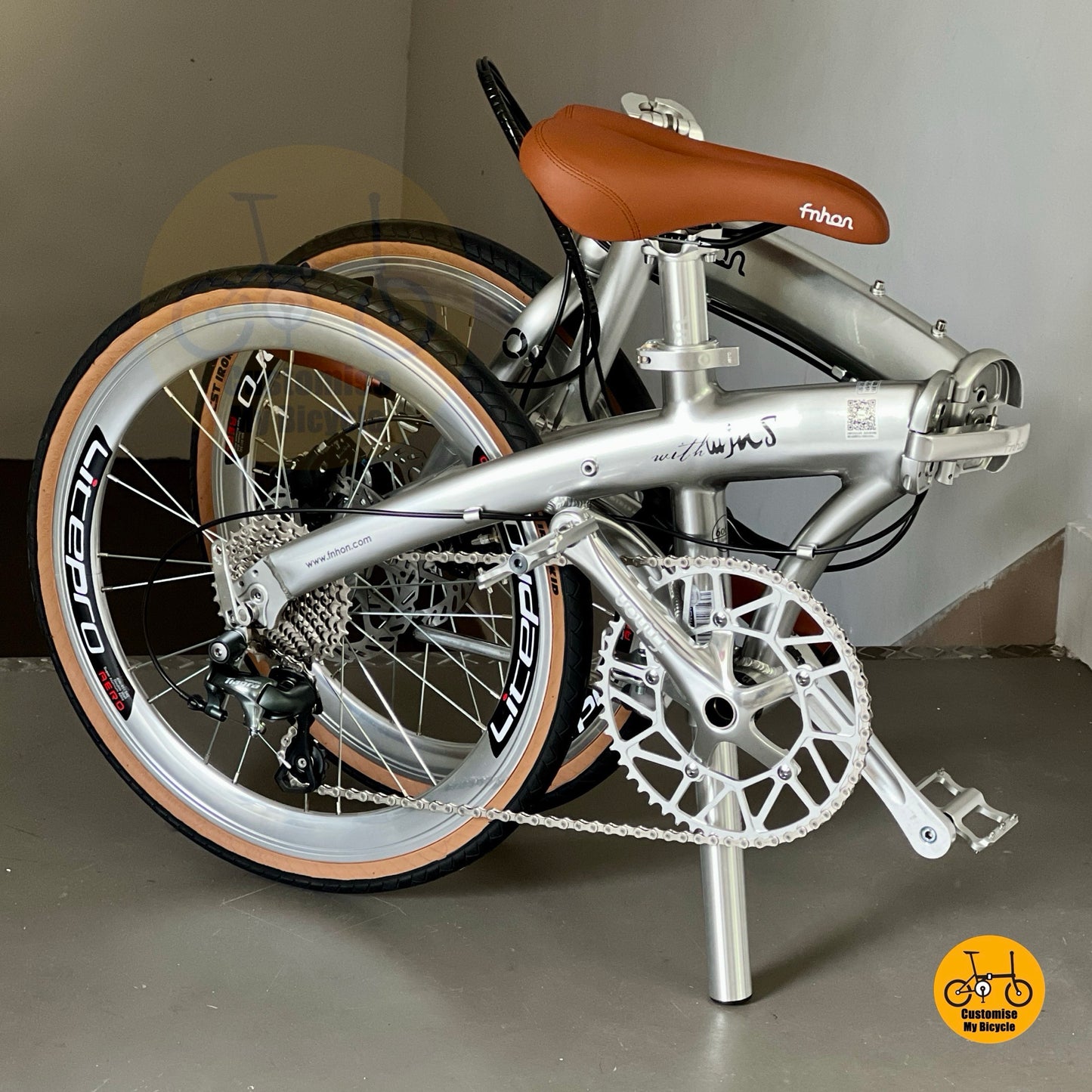 Full studio shot of Fnhon Wind 22 inch metallic silver foldable bicycle