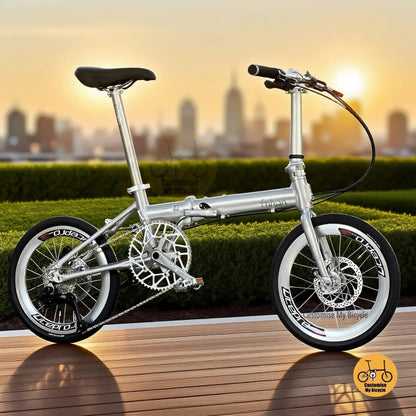 Full side view of Fnhon Zephyr 18-inch folding bike in polished silver, displayed on wooden deck with city skyline at sunset.

